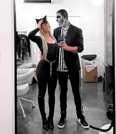 Kathryne Padgett posted a picture cosplaying catwoman along with a guy.